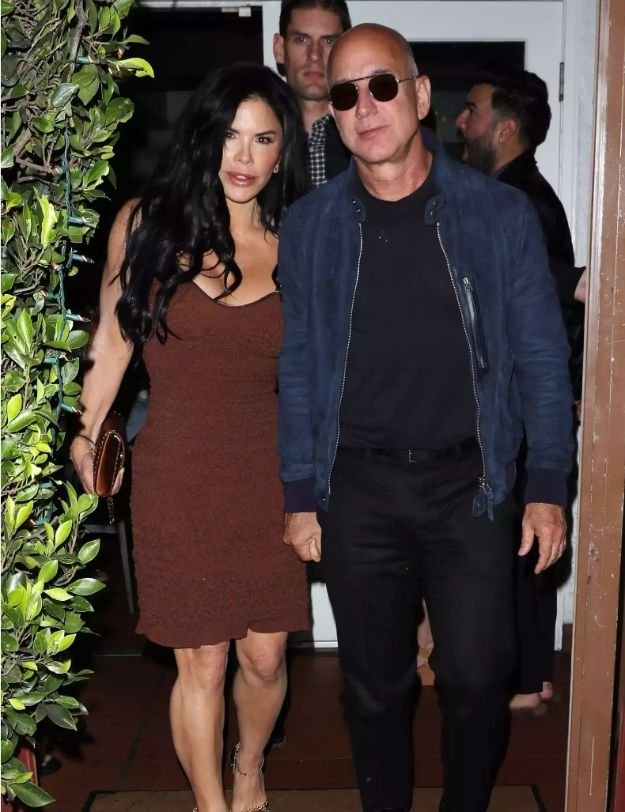 Jeff Bezos and Lauren Sanchez hold hands after dinner with friends at Giorgio Baldi in Los Angeles